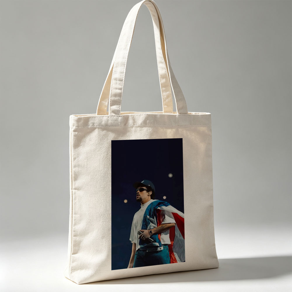 Bad Bunny Performing on Stage with Puerto Rican Flag Draped Over Shoulders - Canvas tote bags
