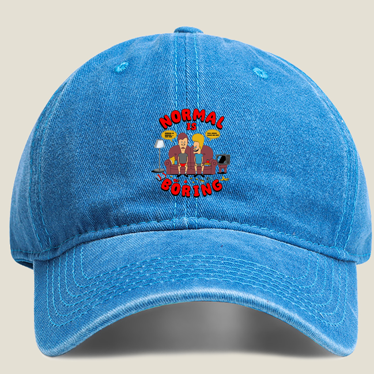 Normal Is Boring: Two Cartoon Characters on Couch with Chaos Around - Washed Denim - Baseball Cap