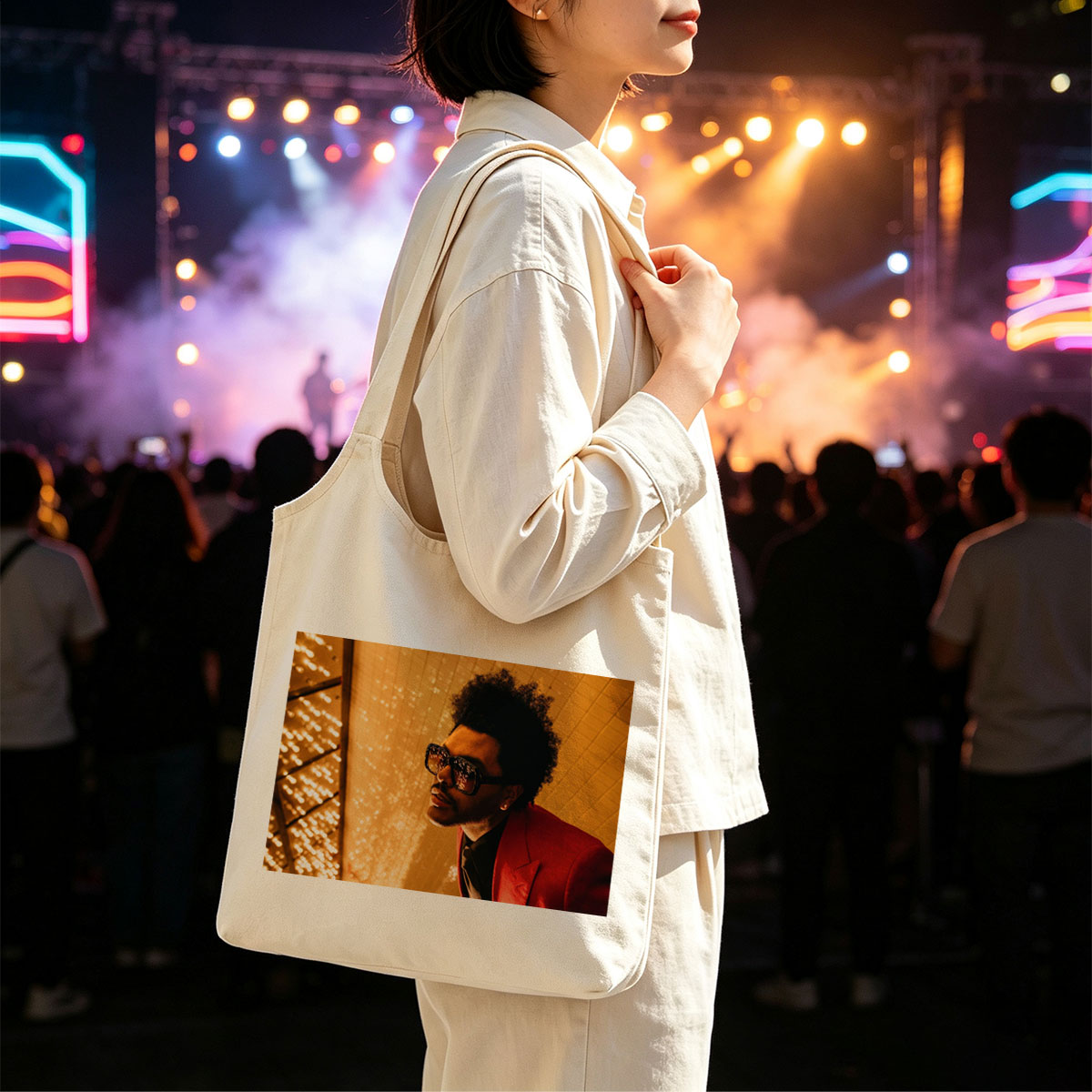 The Weeknd in a Red Suit and Sunglasses Against a Golden Lighted Background - Canvas shoulder bags/