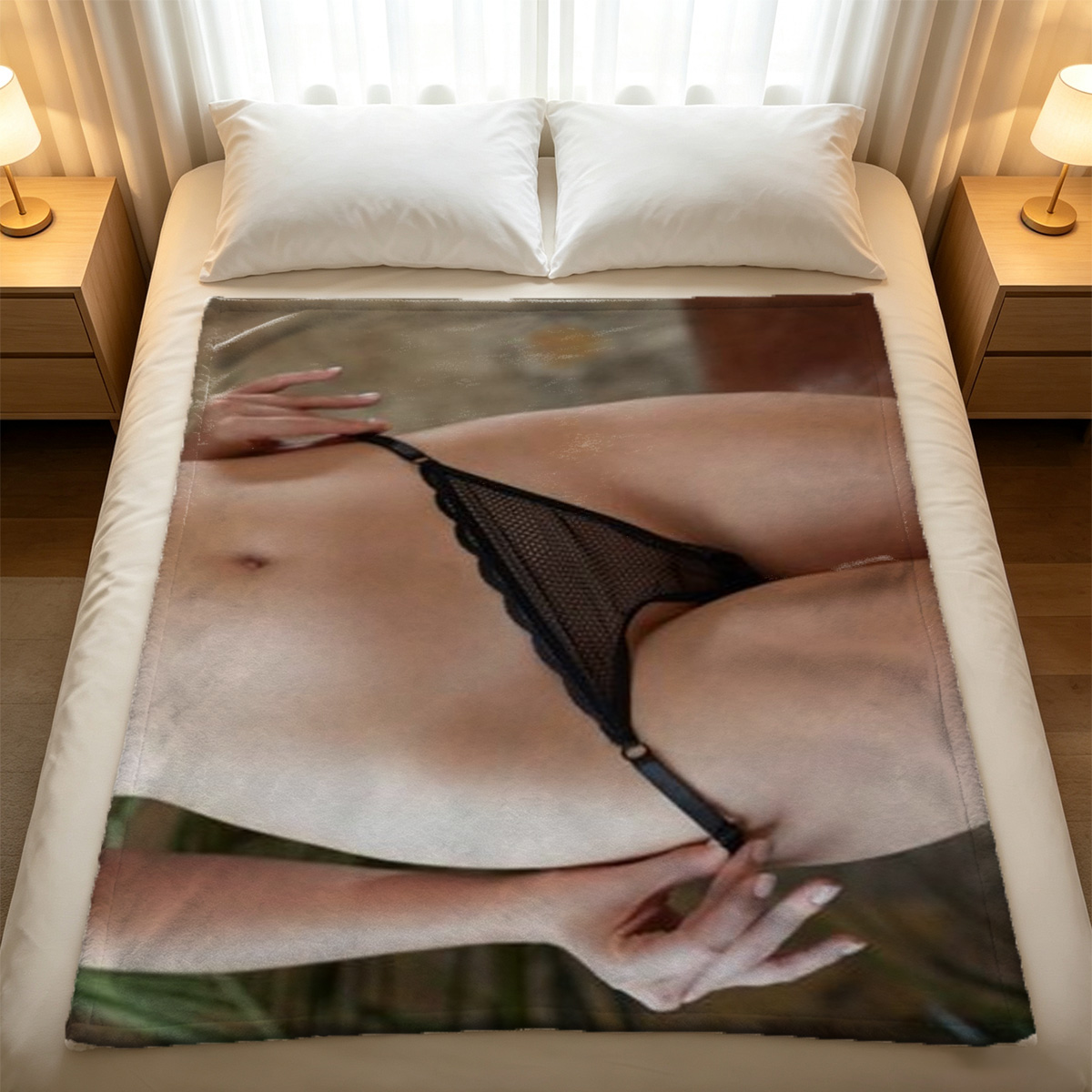 Nude Asian beauty kneeling on pillow, pulling black sheer lingerie over breasts in luxury hotel room. - Blanket