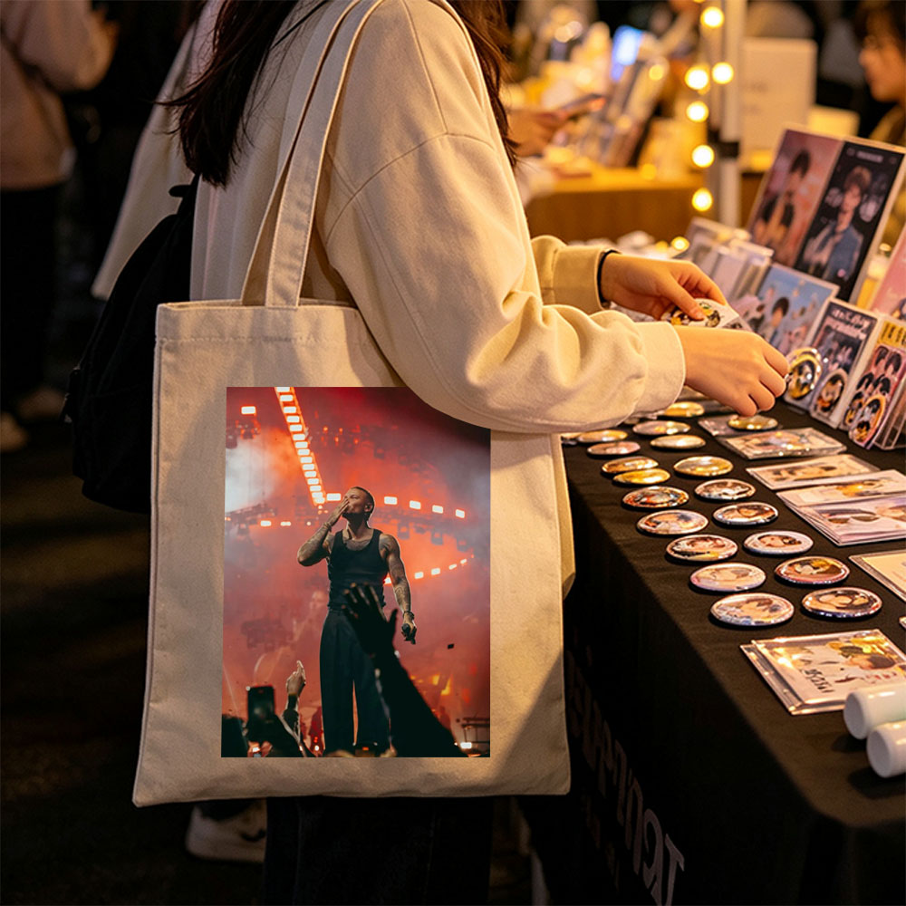 Tory Lanez on Stage Performing at a Concert with Intense Red Lighting and Crowd Engagement - Canvas tote bags