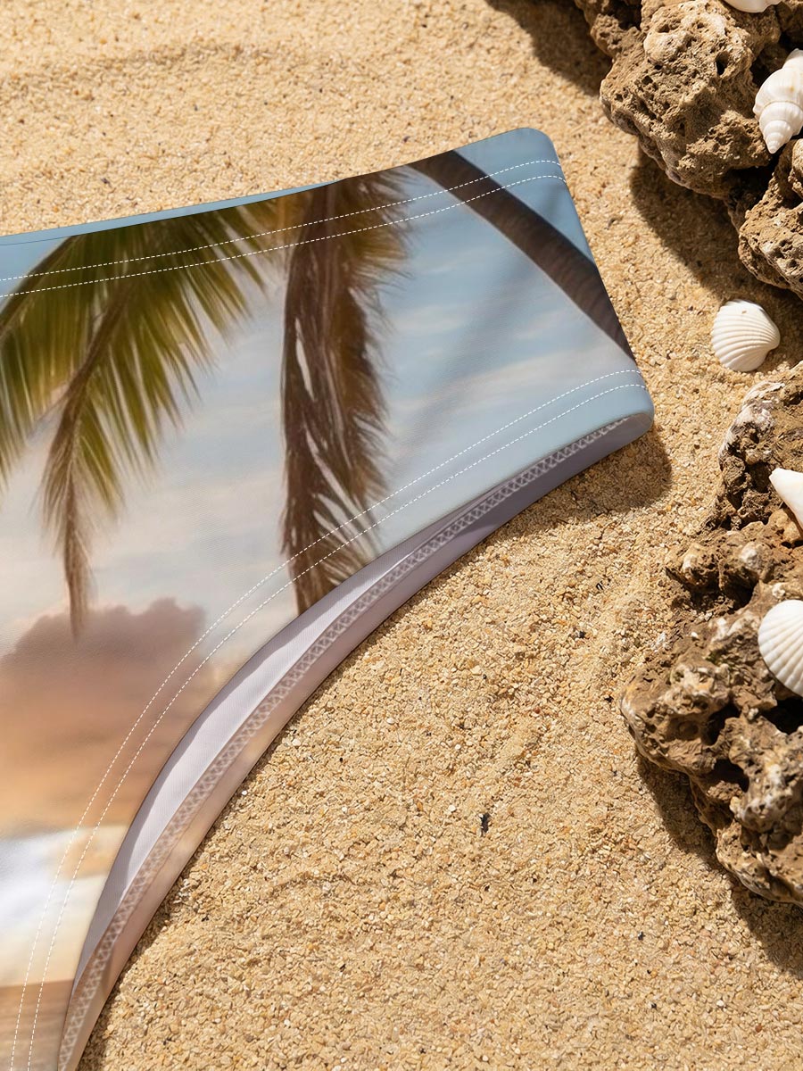 Sunset on a tropical beach with palm trees and calm ocean waves. -  Men's swim trunks