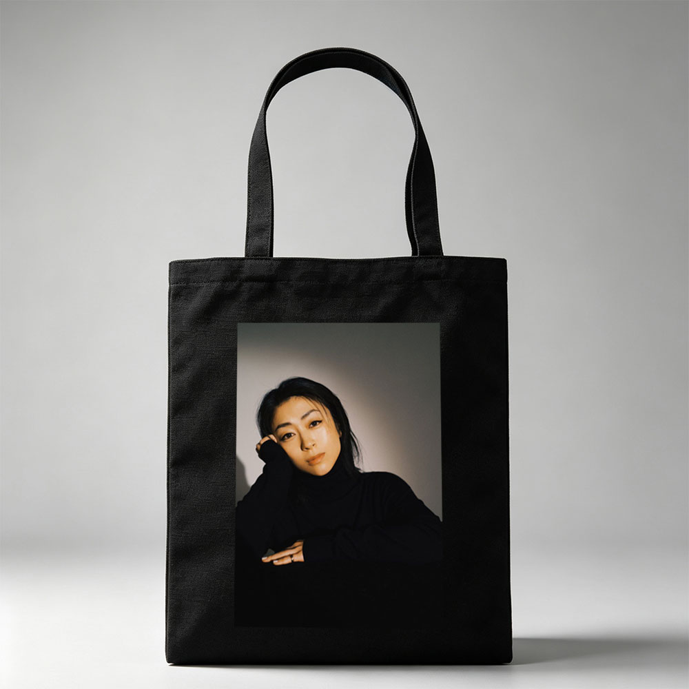 Yoko Kanno in a Moody Portrait Wearing Black Turtleneck with Dramatic Lighting - Canvas tote bags