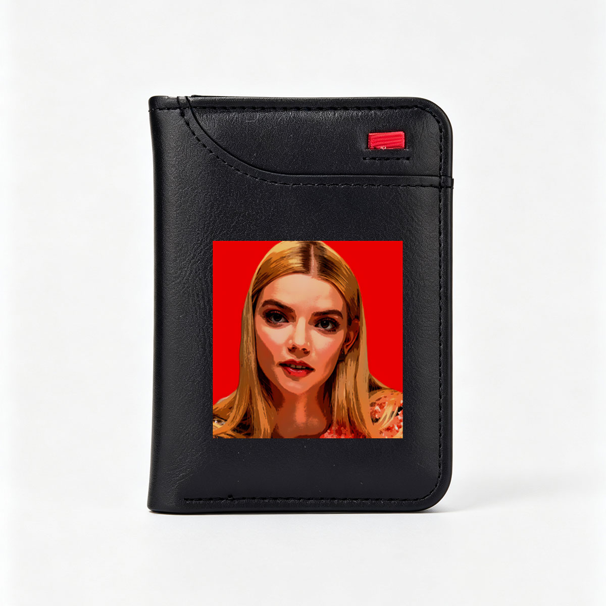 Anya Taylor-Joy in a stylized portrait with bold red background - Vertical Style Wallet