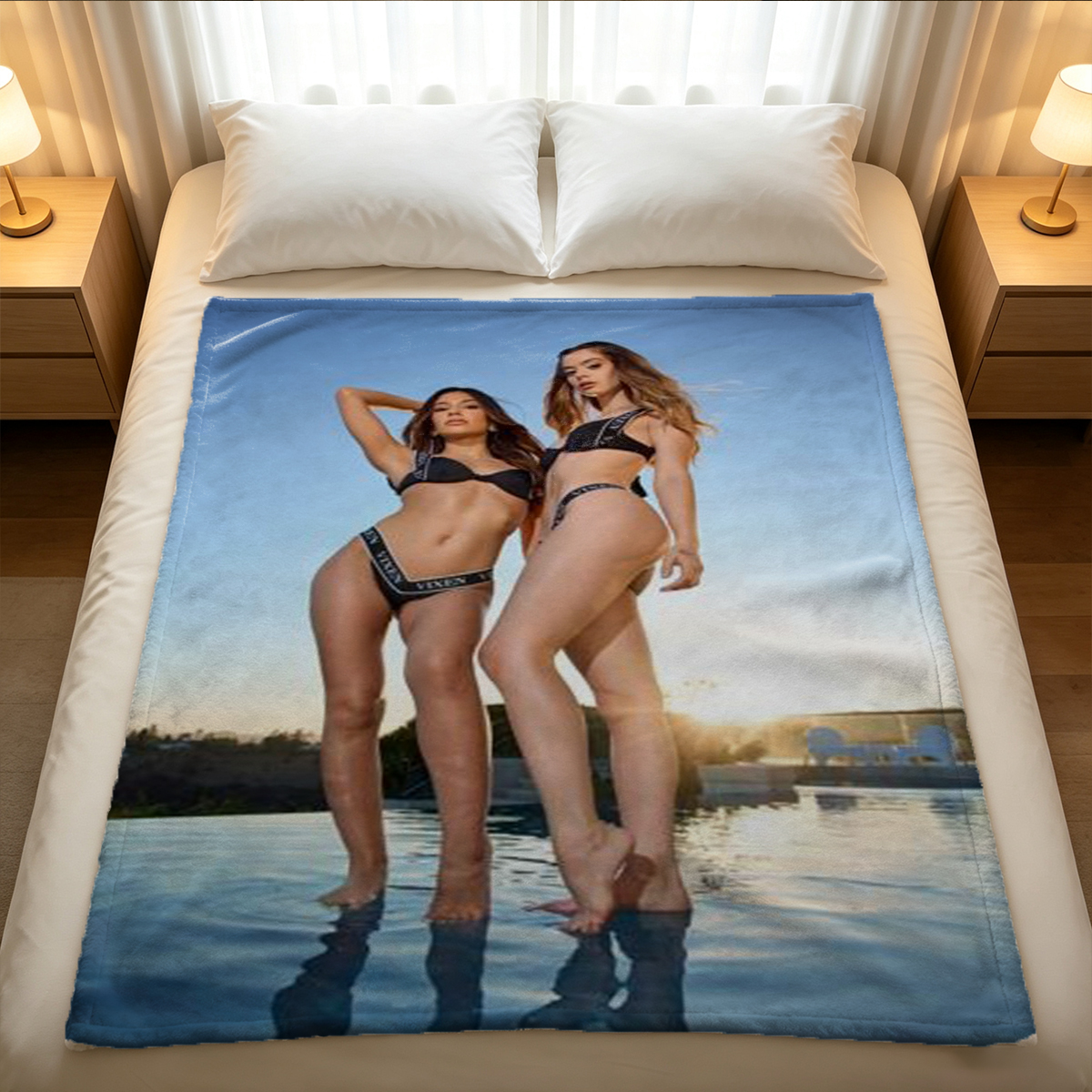 A woman in black lingerie and sheer pantyhose posing seductively on a bed. - Blanket