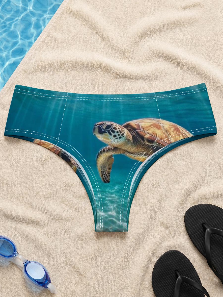 Sea turtle glides through sunlit waters, rays shimmering above. -  Men's swim trunks