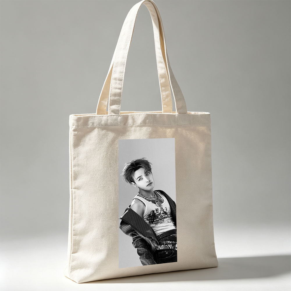 Dino from SEVENTEEN in a stylish black and white portrait wearing a graphic tank top and layered accessories. - Canvas tote bags