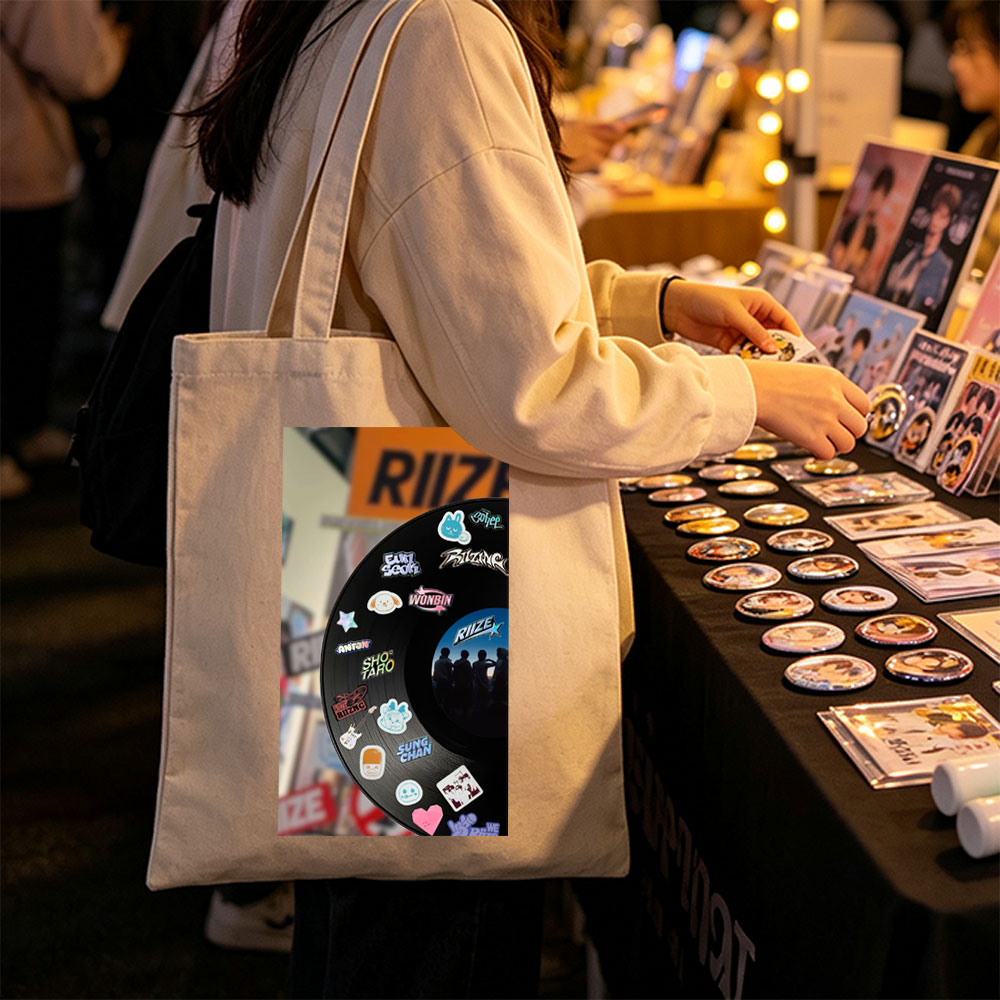 RIIZE Vinyl Record with Member Stickers and Band Logo Displayed in Store Window - Canvas tote bags