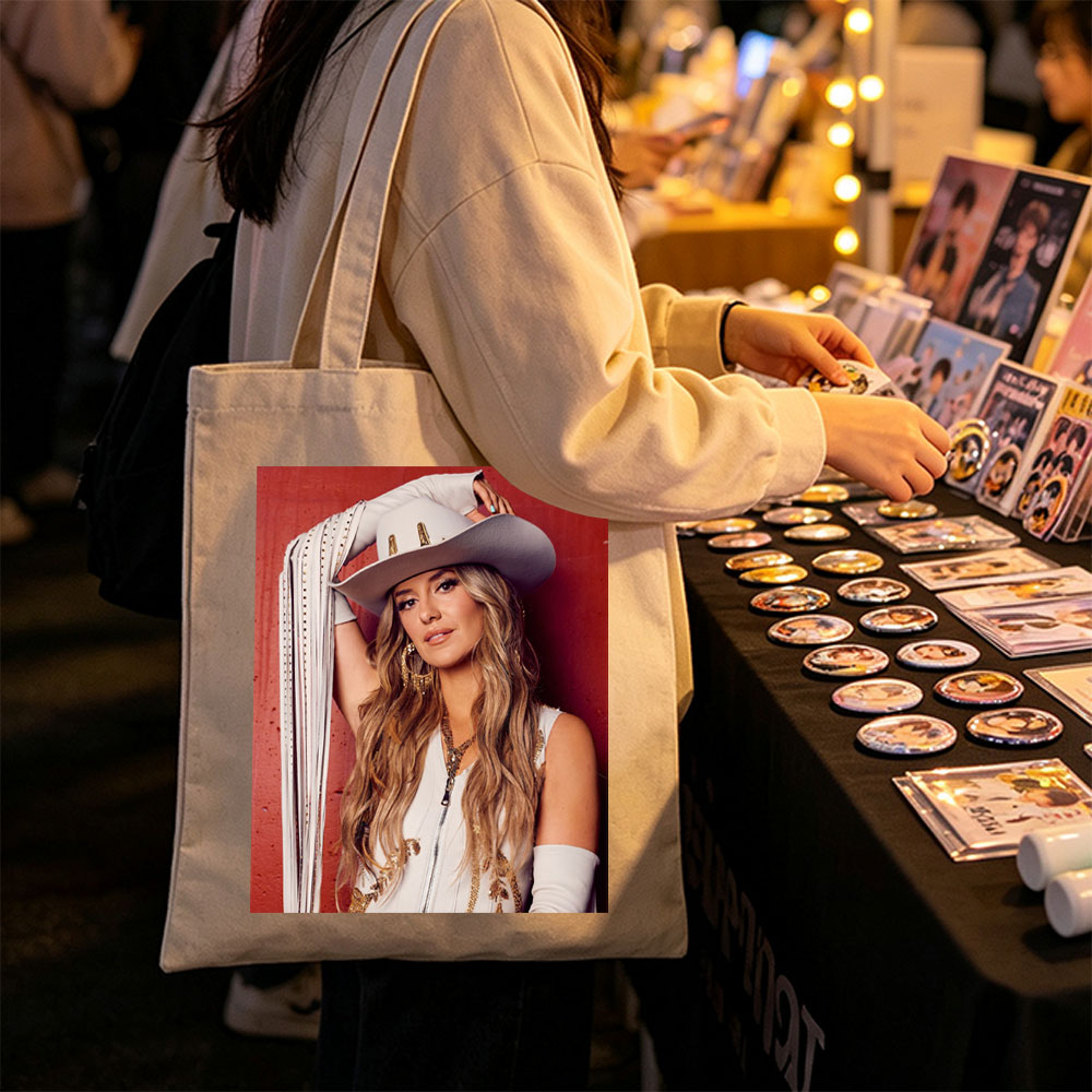 Lindsay Ell in a Cowboy Hat and Western Outfit Against a Red Background - Canvas tote bags