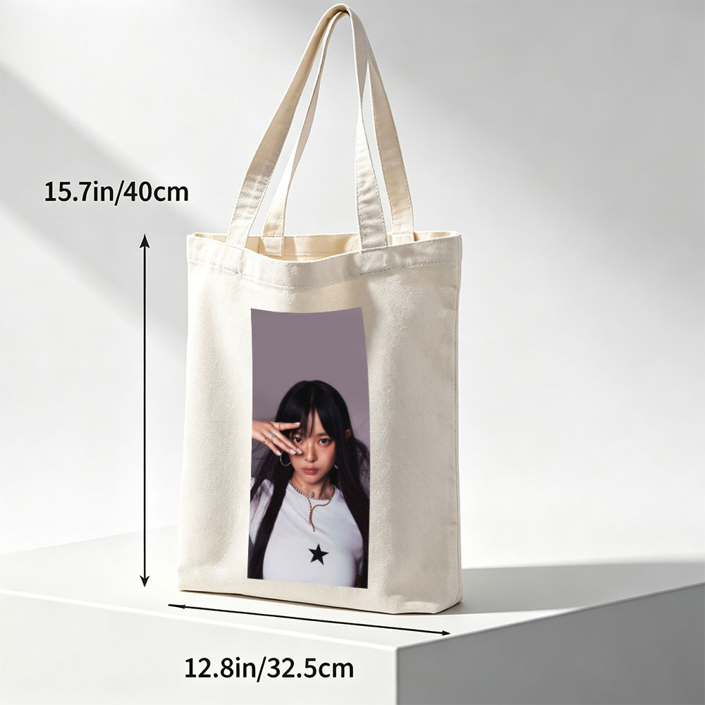 Hanni of NewJeans in a Stylish Pose with Star-Printed White Top and Elegant Jewelry - Canvas tote bags