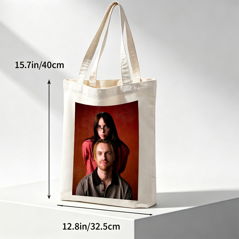 The Postal Service - Portrait of Ben Gibbard and Jenny Lewis Against a Warm Red Background - Canvas tote bags