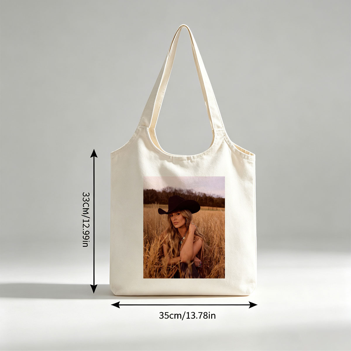 Paris Hilton in a Field of Golden Grass Wearing a Black Cowboy Hat and Boho Outfit - Canvas shoulder bags/