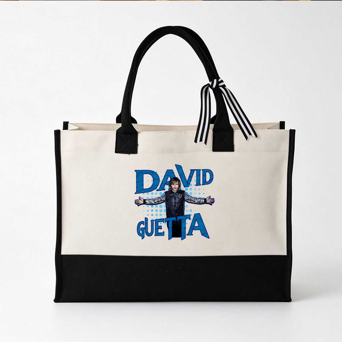 David Guetta in a stylized graphic with bold blue text and a dotted background - Canvas patchwork gift tote bag