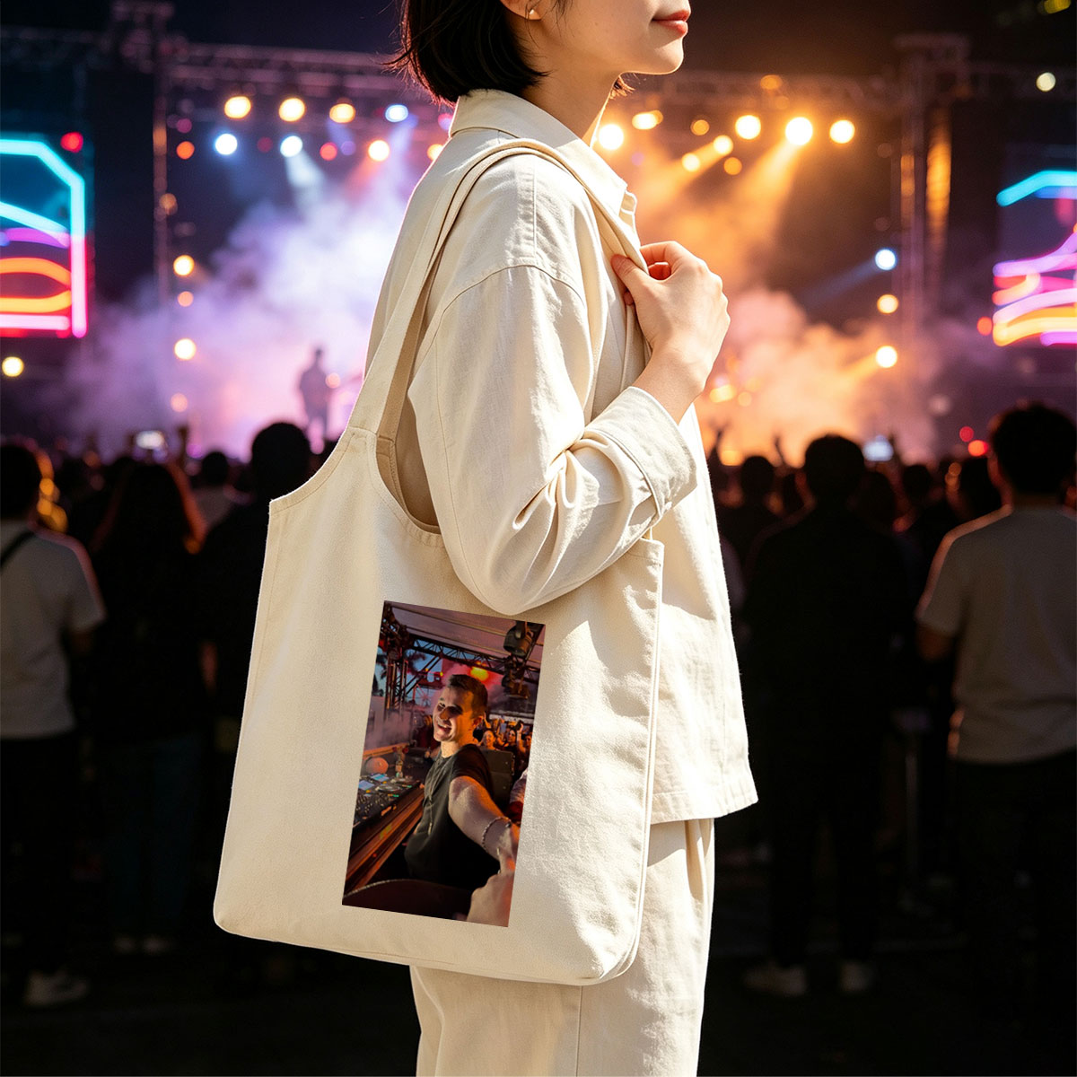 Martin Garrix at a Live DJ Set Performing for an Energetic Crowd Under Colorful Stage Lights - Canvas shoulder bags/