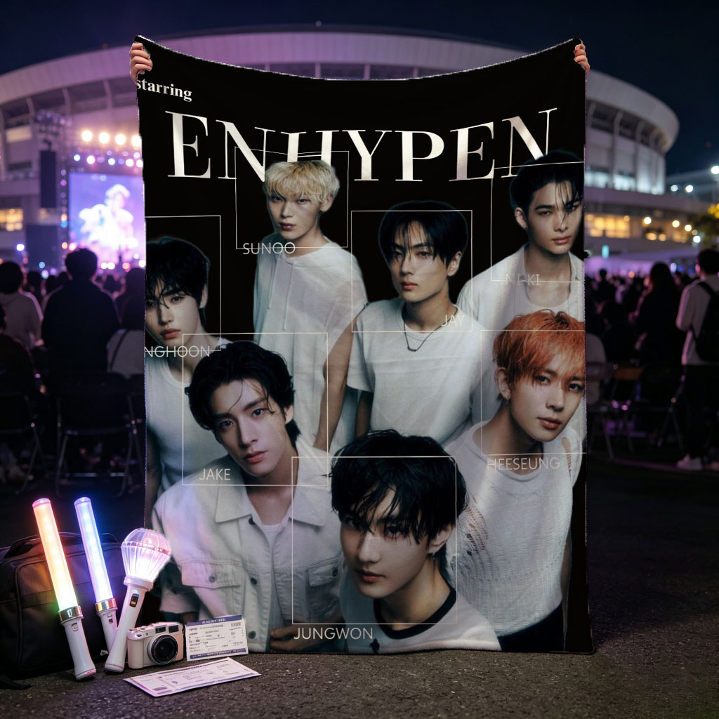 ENHYPEN in a striking black-and-white group portrait featuring all members in minimalist white outfits with individual name labels against a dark background - Blankets