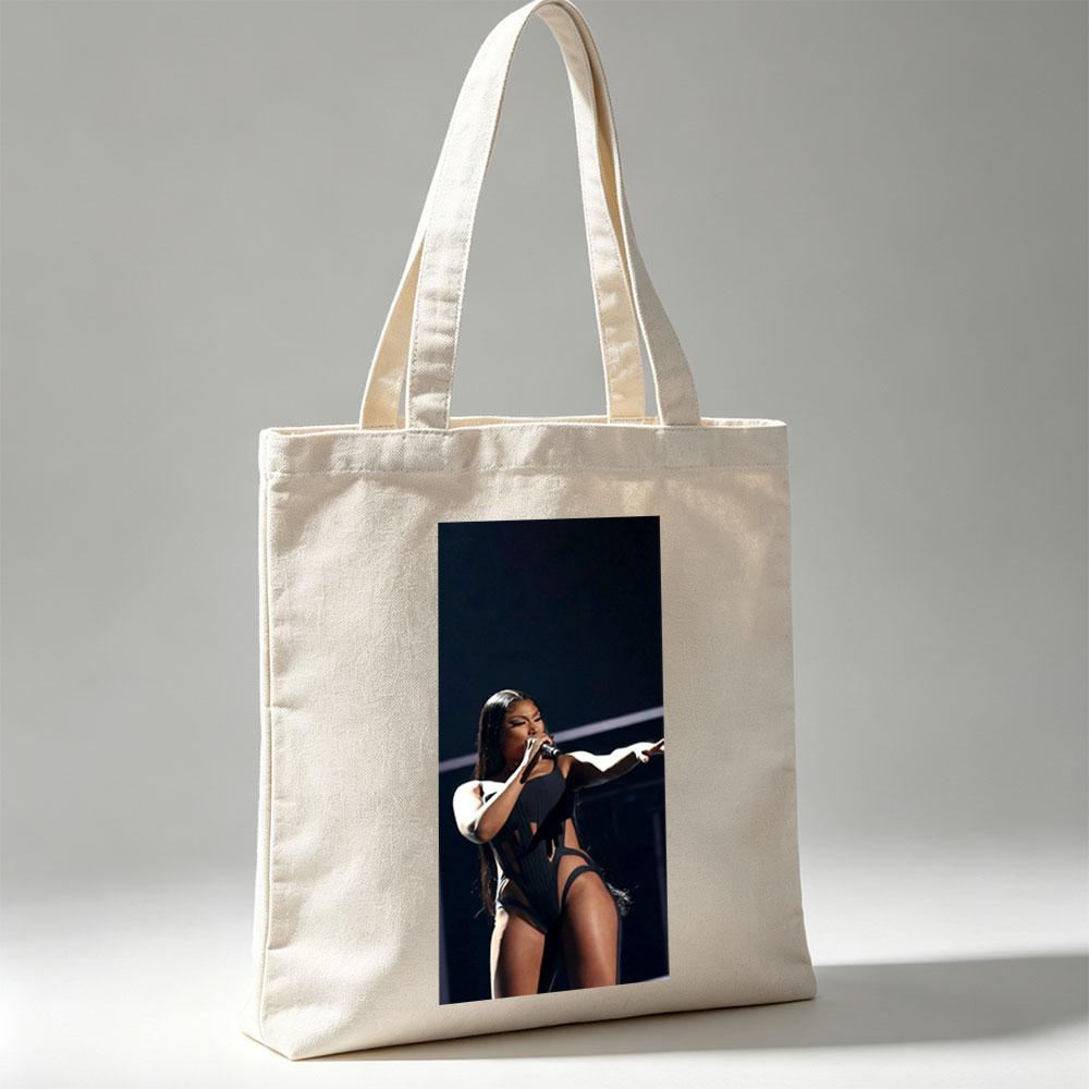 Cardi B Performing on Stage in a Black Bodysuit Holding a Microphone - Canvas tote bags