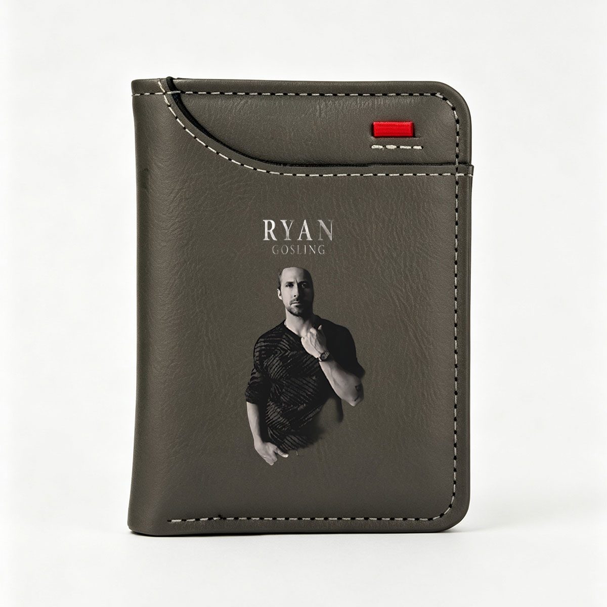 Ryan Gosling in a stylish black shirt, posing with hand on chest against dark background - Vertical Style Wallet