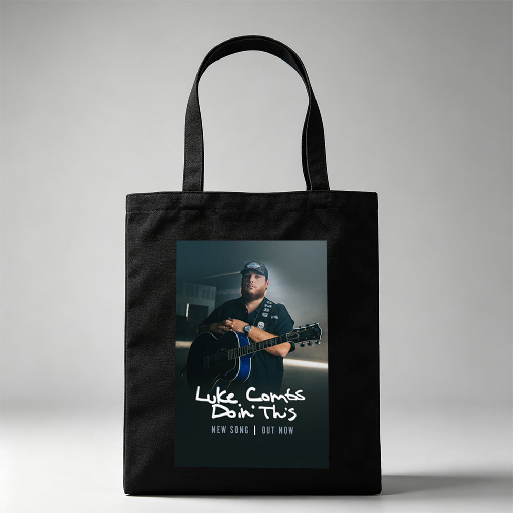 Luke Combs Holding Acoustic Guitar in Dark Studio Setting for New Song Release - Canvas tote bags
