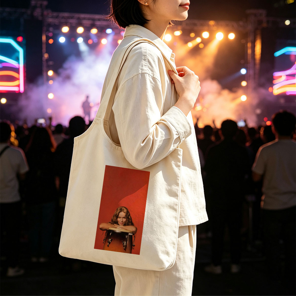 Rita Ora Leaning on a Drum Against a Red Background - Canvas shoulder bags/