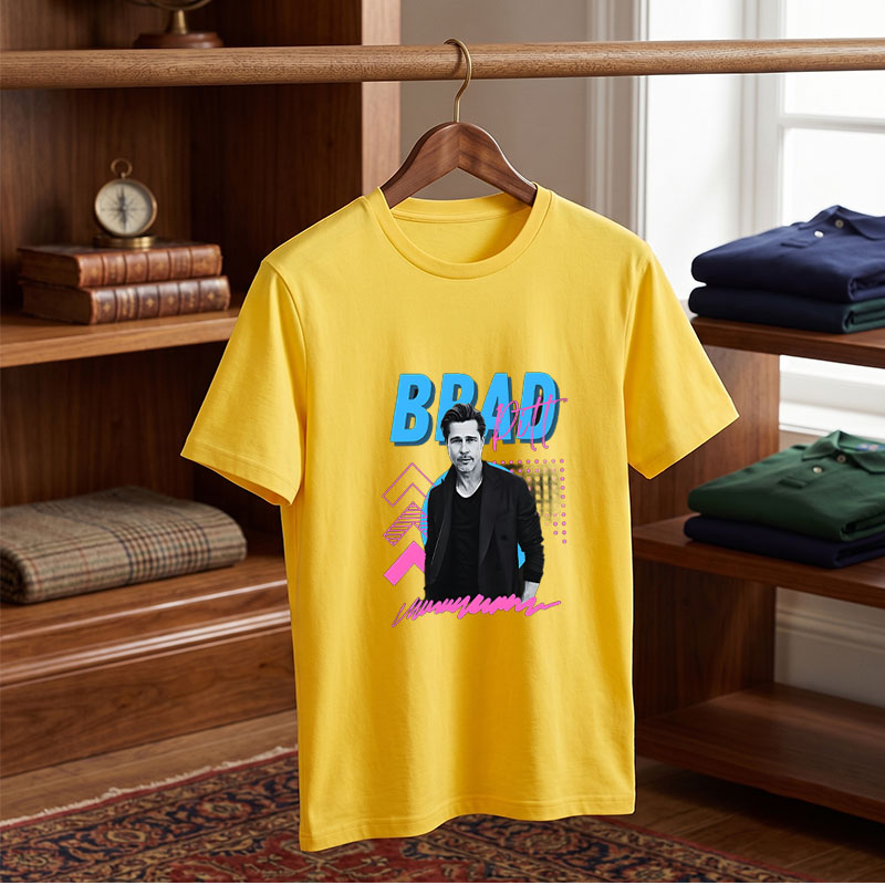 Brad Pitt in a stylish black suit against a vibrant graphic background with bold text and geometric patterns. - Tee