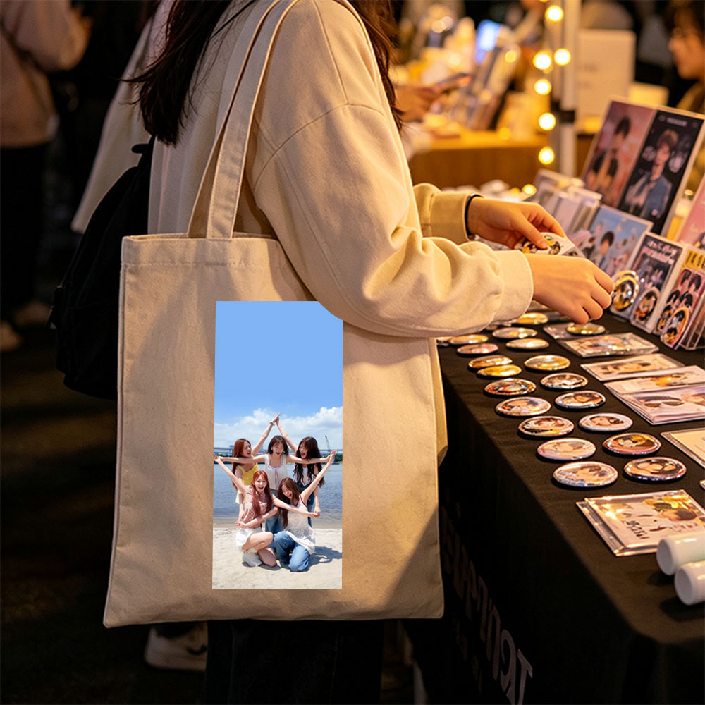 NewJeans at the Beach - Five Members Posing in a Star Shape Under Blue Sky - Canvas tote bags