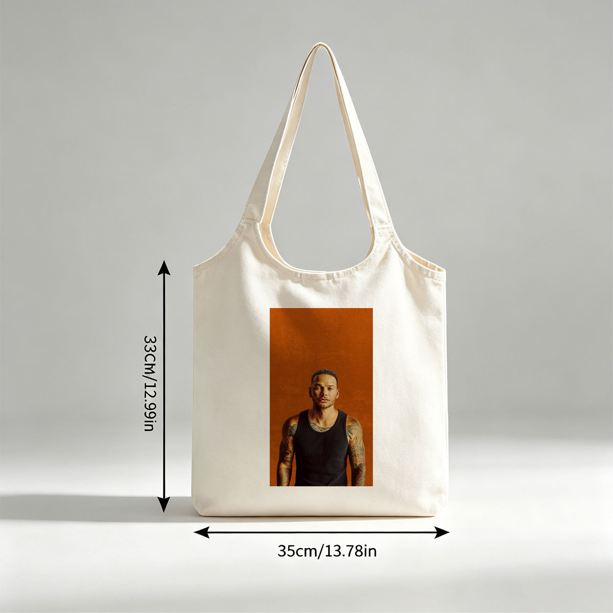 Liam Payne Standing in Black Tank Top with Visible Tattoos Against Orange Background - Canvas shoulder bags/