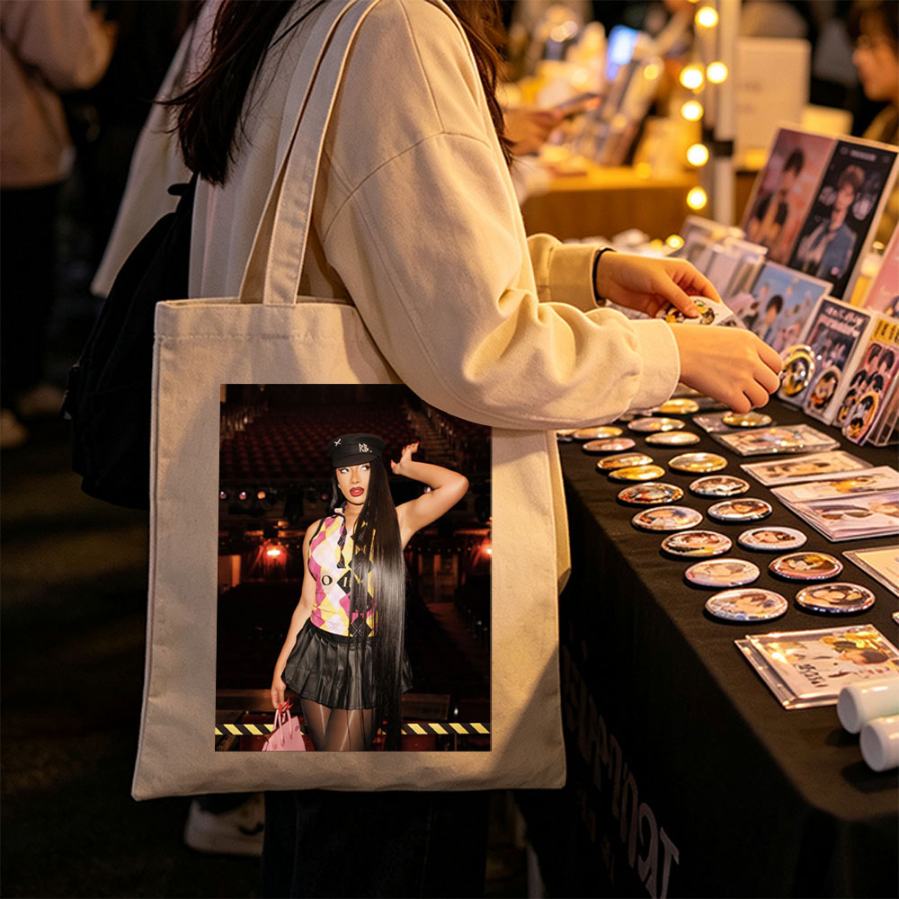 Cardi B in a Bold Outfit at a Concert Venue with Vibrant Lighting and Stage Setup - Canvas tote bags