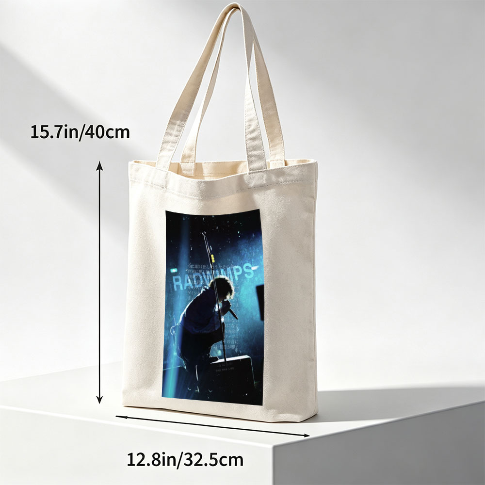 RADWIMPS Live Performance - Singer on Stage with Microphone and Dramatic Lighting - Canvas tote bags