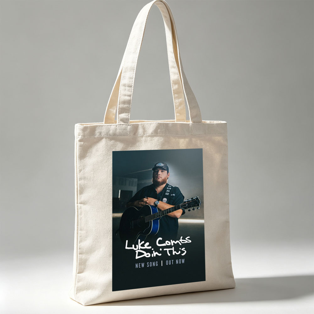 Luke Combs Holding Acoustic Guitar in Dark Studio Setting for New Song Release - Canvas tote bags
