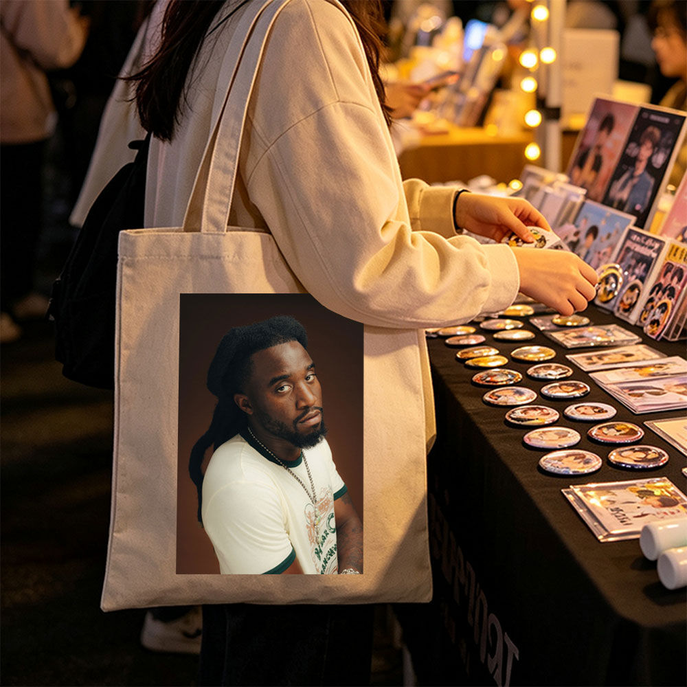 Burna Boy in a Stylish Portrait Wearing a White T-Shirt and Beaded Necklace - Canvas tote bags