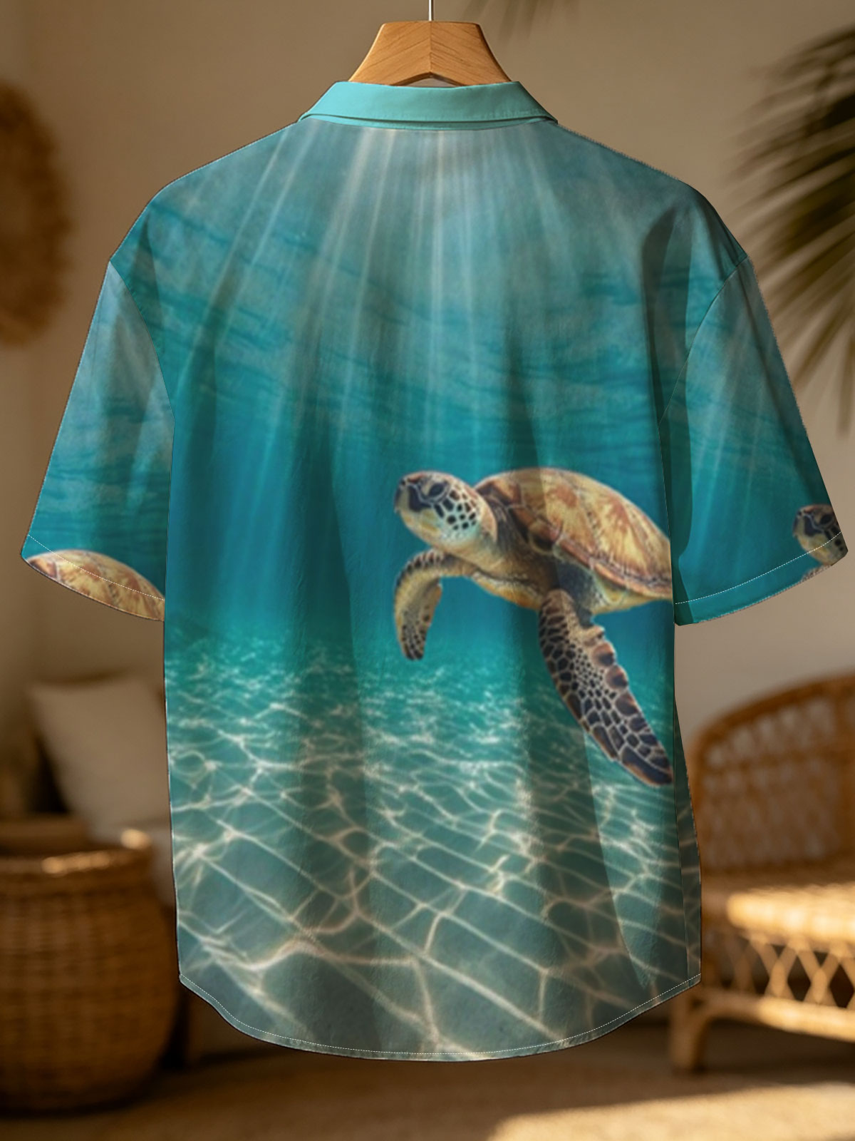 Sea turtle glides through sunlit waters, rays shimmering above. -  Shirt
