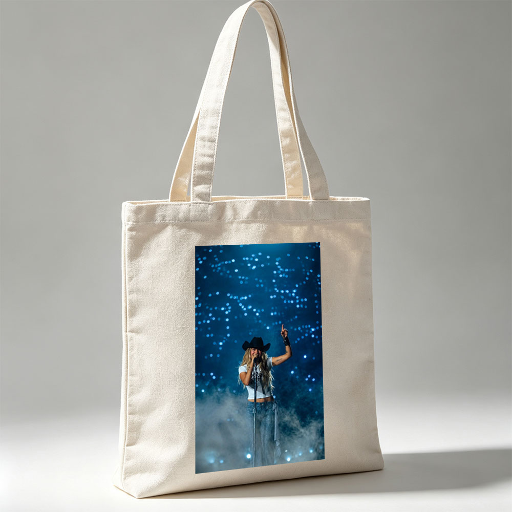 Miranda Lambert on Stage Performing with a Microphone and Cowboy Hat Under Blue Lights - Canvas tote bags