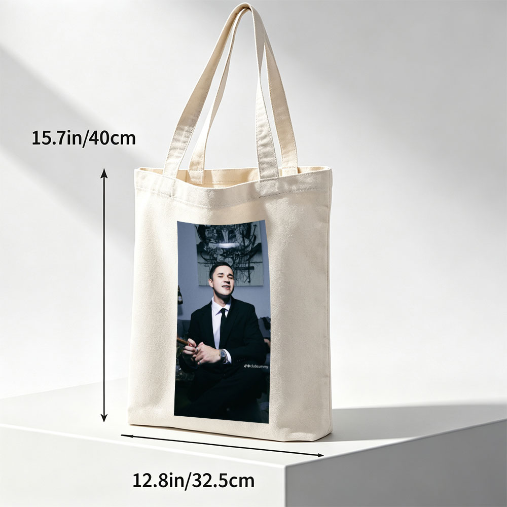 Pete Davidson in a Suit Holding a Cigar with Artwork in the Background - Canvas tote bags