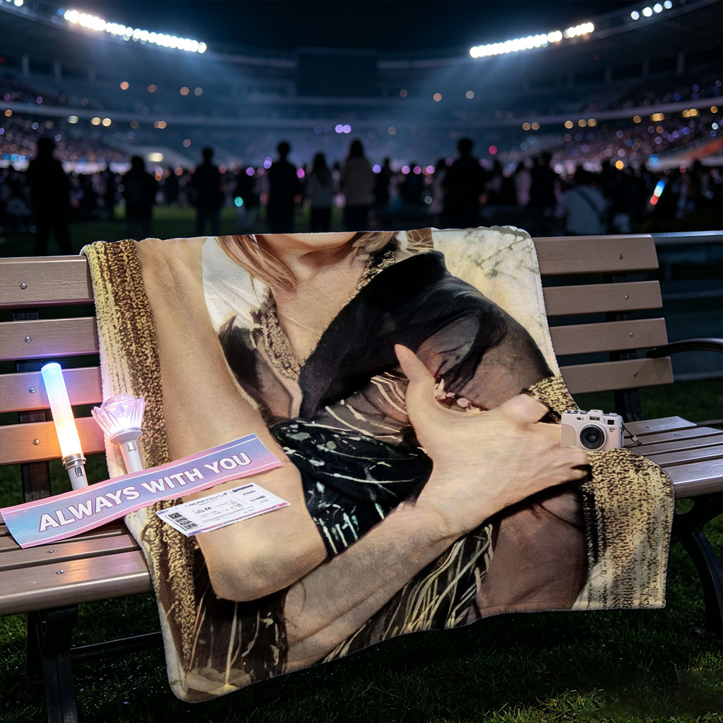 Cher in a Dramatic Pose Wearing a Black and Gold Outfit with Flowing Fabric - Blankets
