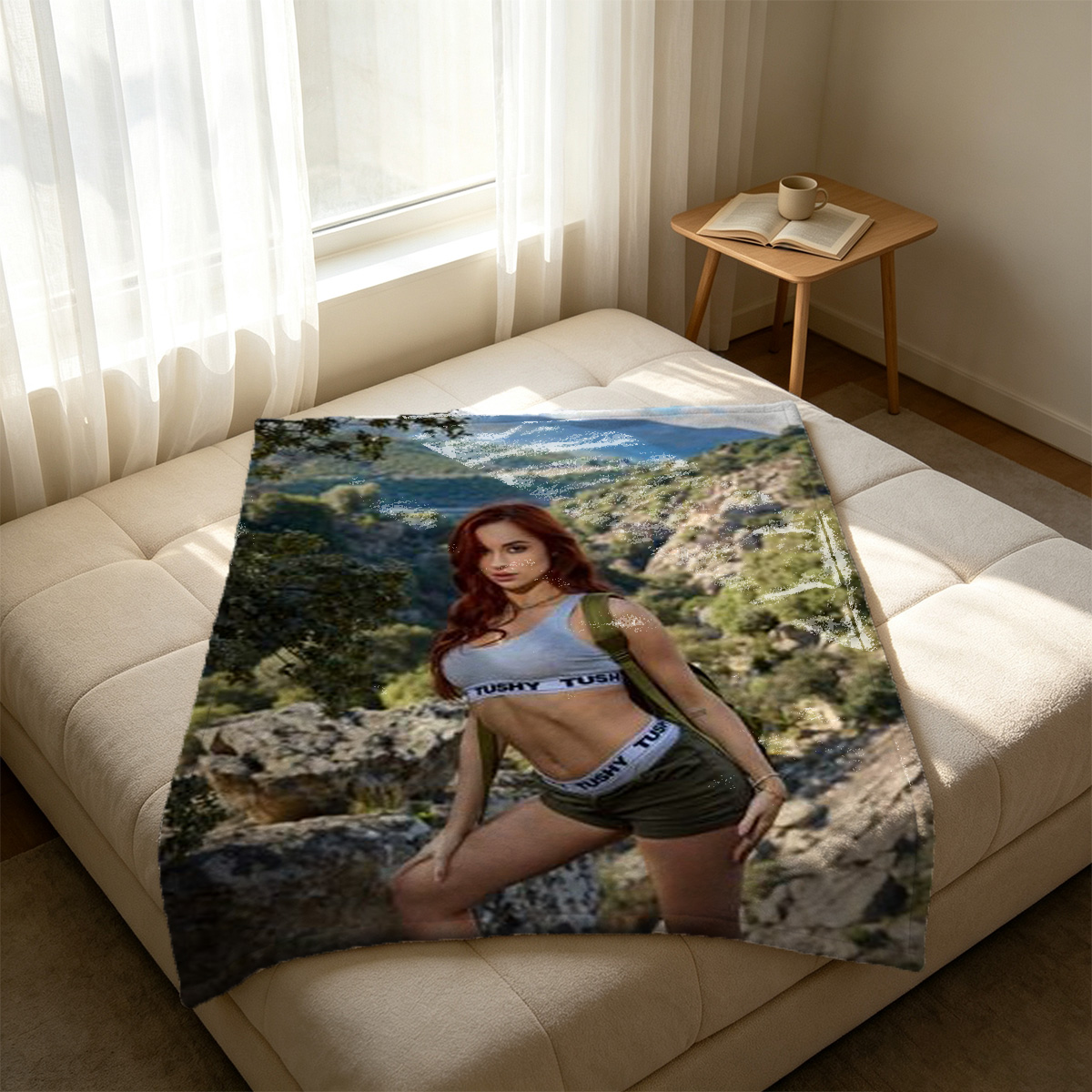 Redhead in pink floral lingerie holding a hand mirror by the window. - Blanket