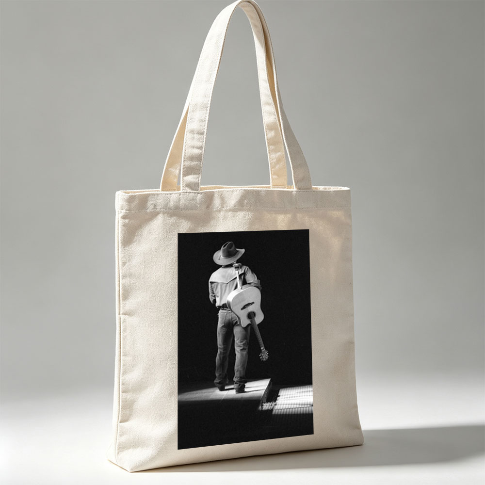 Willie Nelson on Stage with Acoustic Guitar in Black and White Portrait - Canvas tote bags