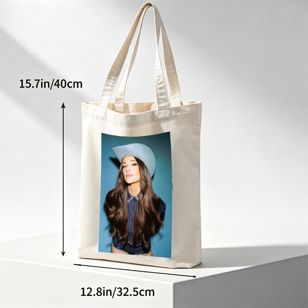 Kacey Musgraves in a Cowboy Hat and Denim Outfit Against a Blue Background - Canvas tote bags