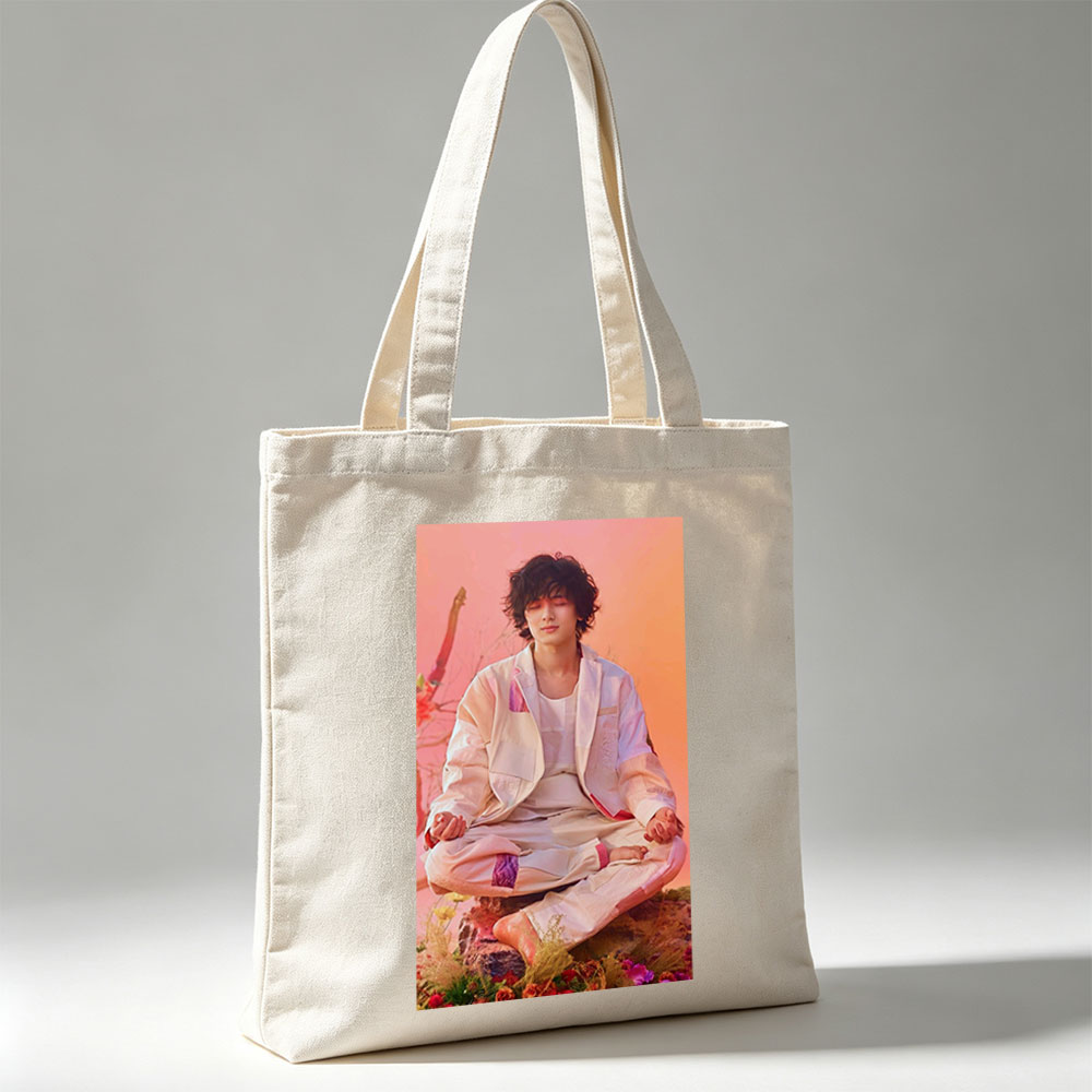 Takuya Kimura Meditating in a Serene Floral Garden with Soft Pink and Orange Background - Canvas tote bags