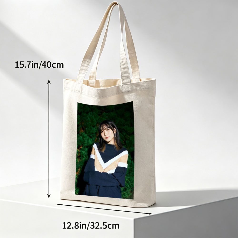Yui Aragaki in a Stylish Outdoor Portrait with Arms Crossed Against Greenery Background - Canvas tote bags