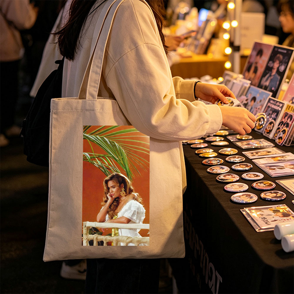 Maren Morris in a Tropical Scene Wearing a White Ruffled Dress with Palm Leaves in the Background - Canvas tote bags