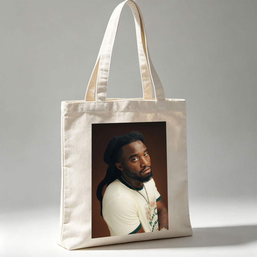 Burna Boy in a Stylish Portrait Wearing a White T-Shirt and Beaded Necklace - Canvas tote bags