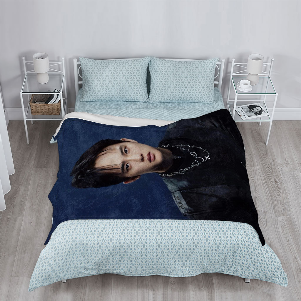 Do Kyung Soo in a Stylish Black Outfit with Layered Necklaces Against a Dark Blue Background - Blankets