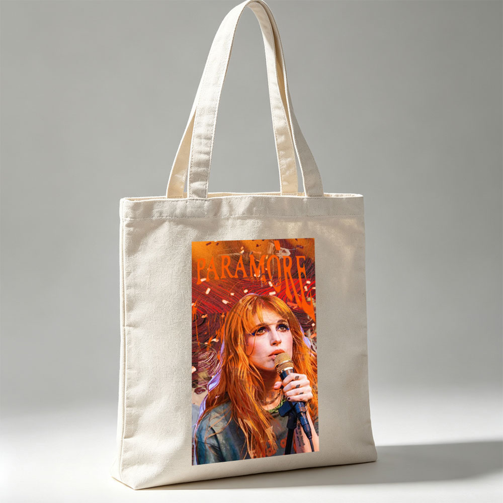 Paramore Live Performance - Hayley Williams Singing into Microphone with Vibrant Stage Background - Canvas tote bags