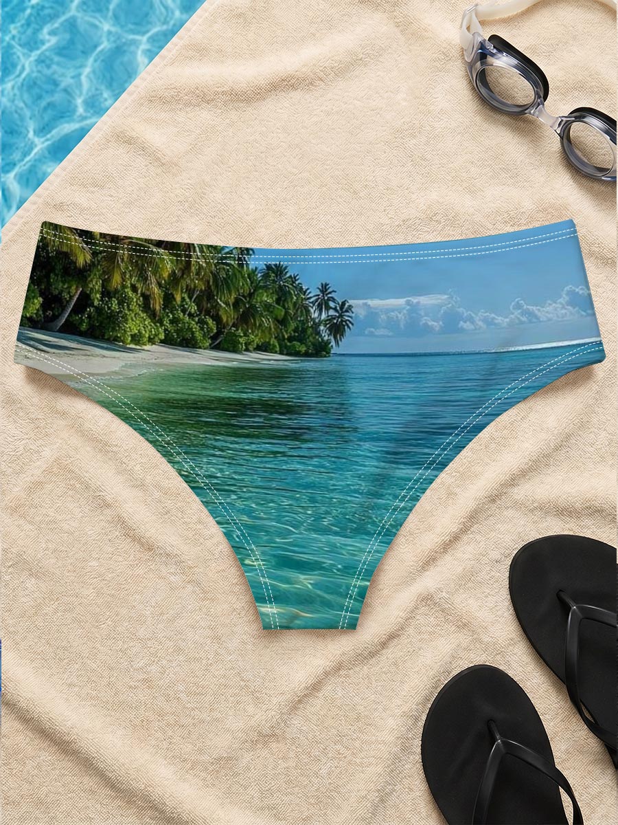 Crystal-clear turquoise waters meet a pristine white sand beach lined with lush palm trees under a bright blue sky. -  Men's swim trunks