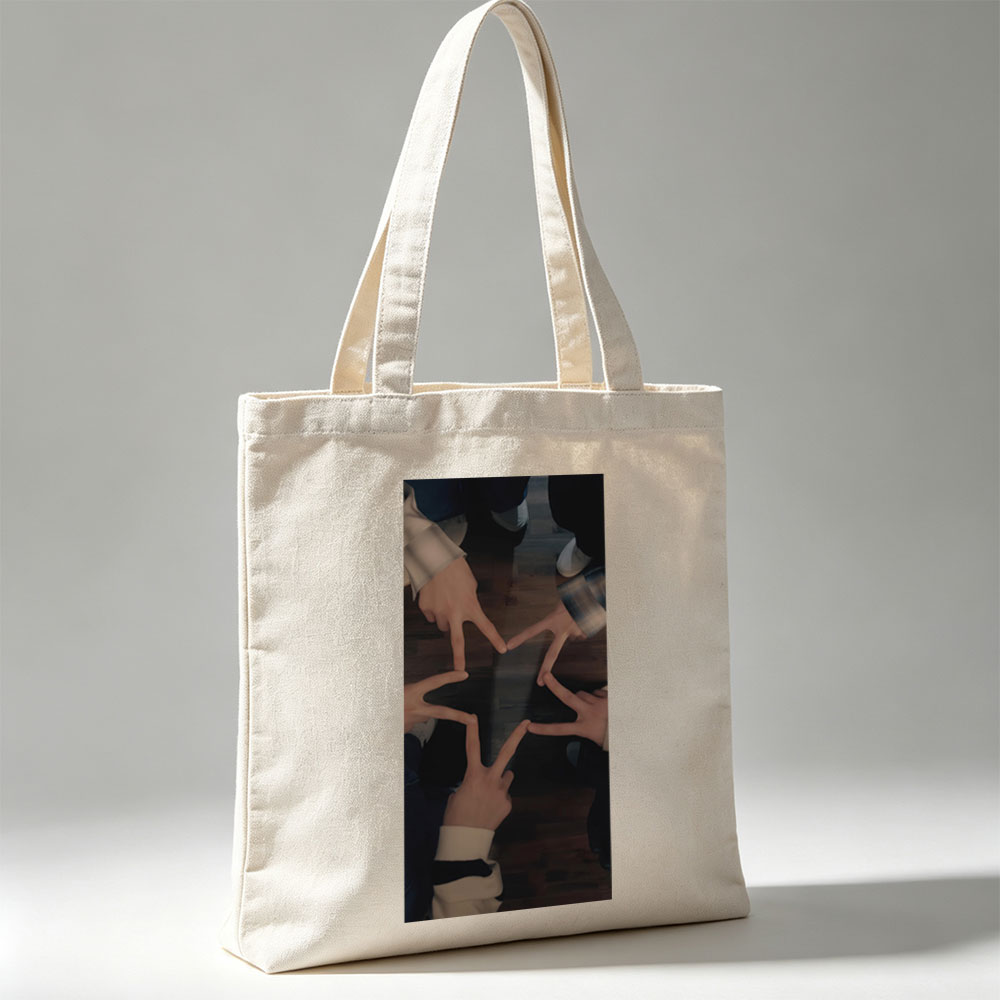 BTS Members Forming a Star with Their Hands on Wooden Floor - Canvas tote bags