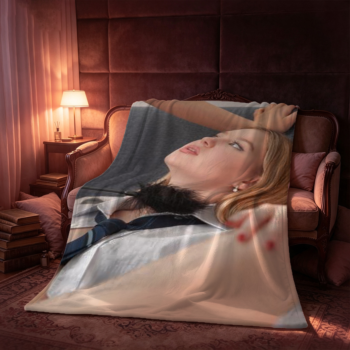 A woman in black sheer lingerie and stockings reclining on a teal couch. - Blanket