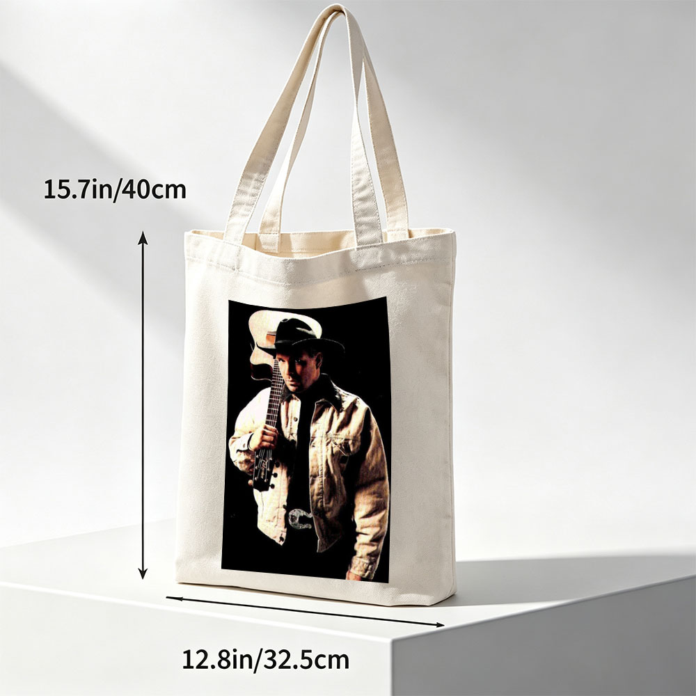 Garth Brook Holding Acoustic Guitar in Cowboy Attire Against Dark Background - Canvas tote bags