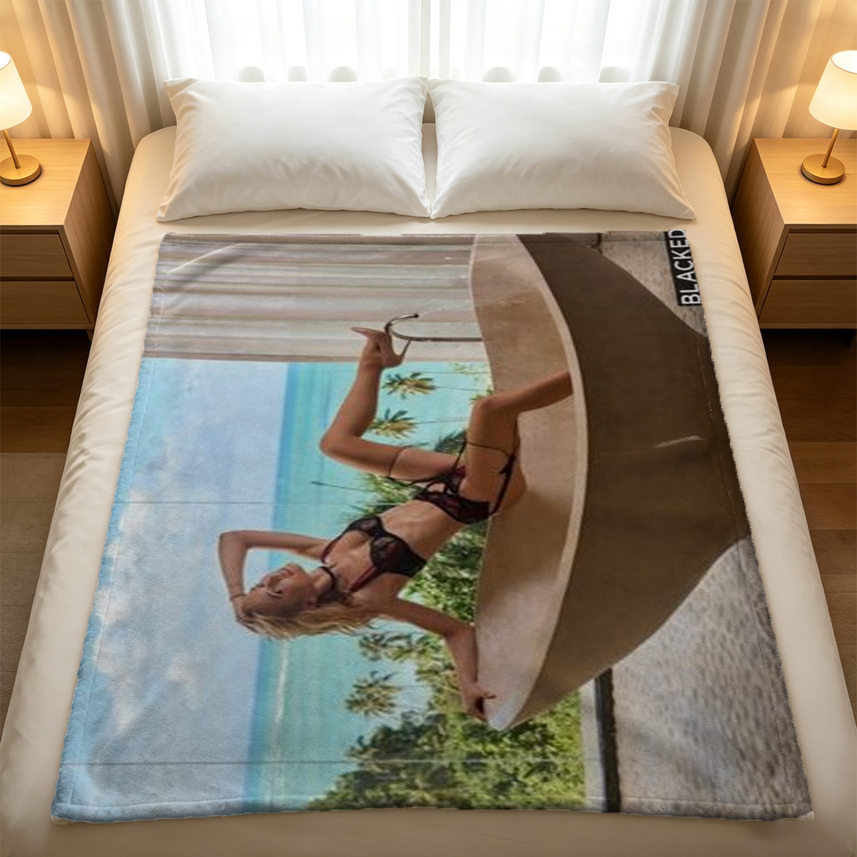 Two seductive women in black lingerie and stockings posing on a golden stool. - Blanket