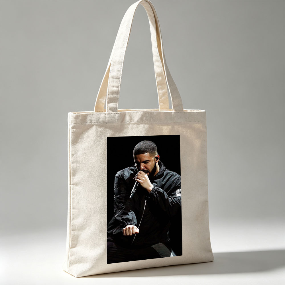 Drake Performing on Stage Holding Microphone in Black Jacket - Canvas tote bags
