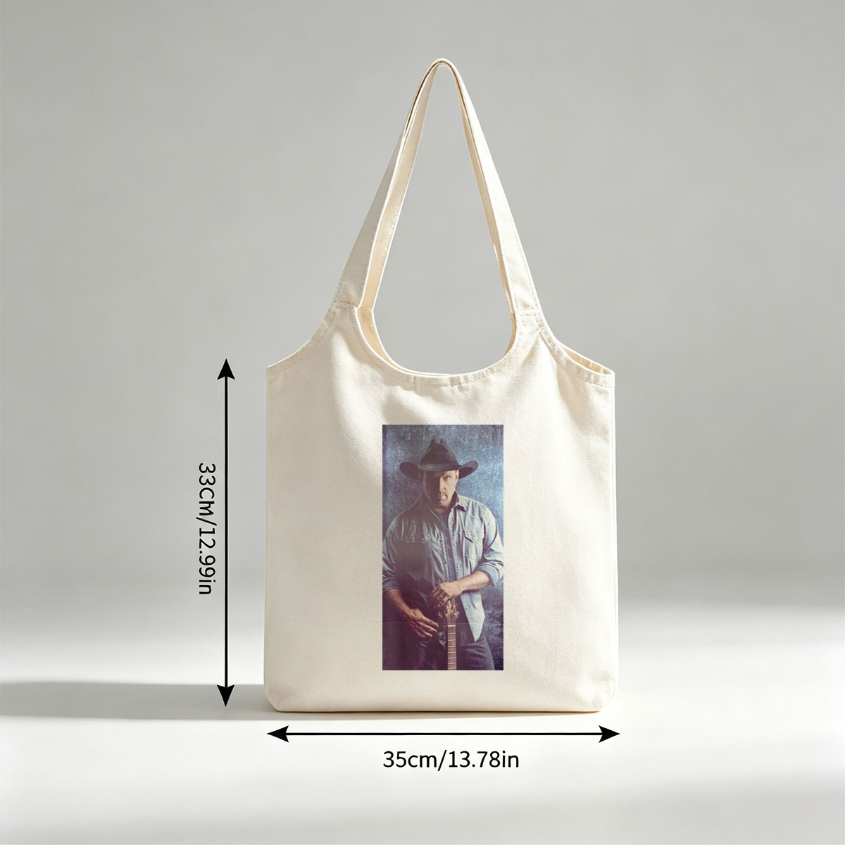 Garth Brook in Cowboy Hat Holding Guitar Against Textured Background - Canvas shoulder bags/